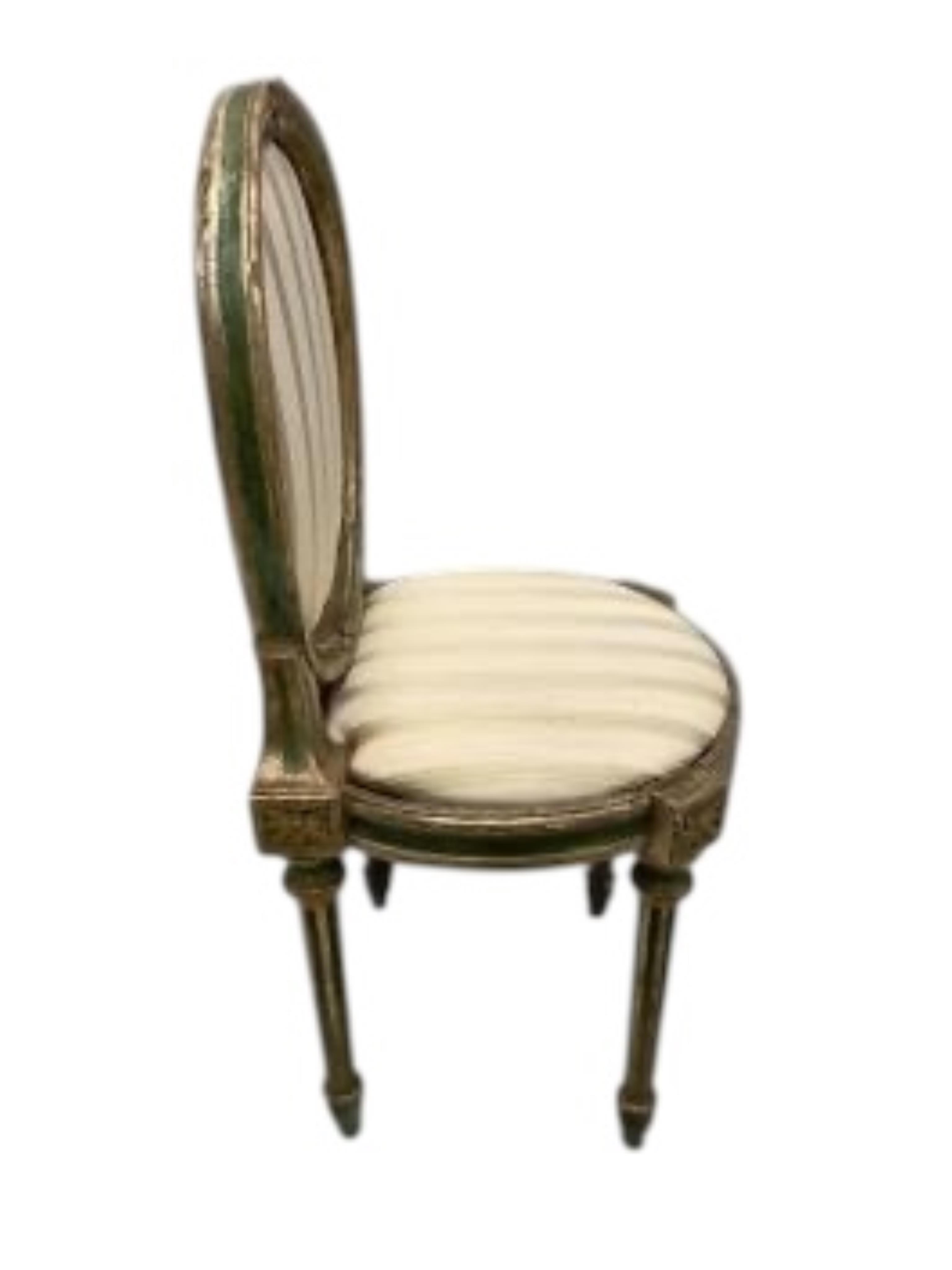 A set of six early 19th century Venetian painted, silvered parcel gilt side chairs, width 44cm, depth 40cm, height 99cm. Condition - fair to good
